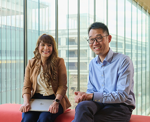 Two business people with a laptop.
